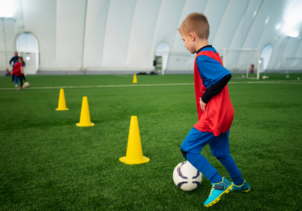 full-shot-kids-playing-football-together