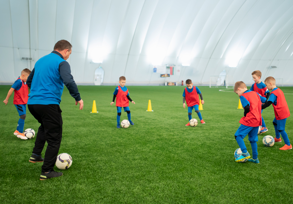 full-shot-kids-playing-football-together